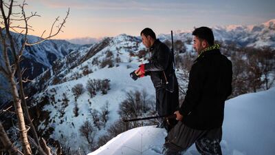 SHARBARZHER, IRAQ: Hunters looking for prey at dusk.