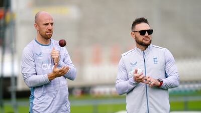 England's Jack Leech and new coach Brendon McCullum. PA