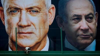 Election posters show Benny Gantz, left, leader of Israel's Blue and White political alliance, and Prime Minister Benjamin Netanyahu. AFP