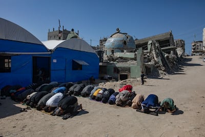 Palestinians perform the first Friday prayer of the holy month of Ramadan beside the ruins of the Al Huda Mosque in the city of Khan Younis. EPA