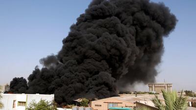 Smoke rises from a storage site in Baghdad, housing ballot boxes from Iraq's May parliamentary election, Iraq on June 10, 2018. Khalid al-Mousily / Reuters