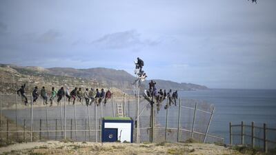 African migrants attempt to scale the fence at the border between Morocco and the North African Spanish enclave of Melilla, Spain. Roughly 70 sub-Saharan migrants tried climb the fence into Melilla this morning, one had to be treated by paramedics. Melilla is a Spanish city and an exclave on the north coast of Africa sharing a border with Morocco. Almost one week ago Some 800 sub- Saharan people made several attempts to reach Spain and according to official sources, ten of them managed to enter Spanish territory. Alexander Koerner / Getty Images)