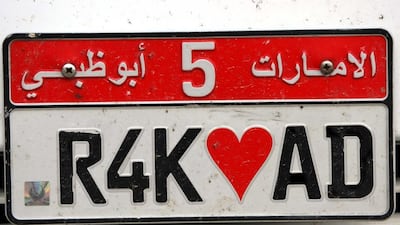 The red of this Abu Dhabi license plate is an in-demand shade among the northern emirates' young drivers. Stephen Lock / The National