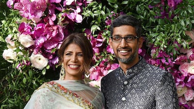 Indian businessman and Google CEO Sundar Pichai (R) poses for photographs with his wife and engineer Anjali Pichai. Photo: AFP
