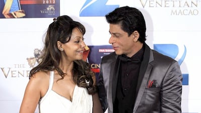 Shah Rukh Khan, right, with his wife, Gauri. AP Photo/Kin Cheung