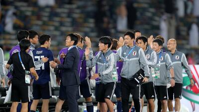 The Japan bench celebrates after the game between Japan and Oman in the Asian Cup 2019 at Zayed Sports City Stadium in Abu Dhabi. Chris Whiteoak / The National