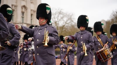 The Band of the Welsh Guards marches at Buckingham Palace to mark the anniversary. PA