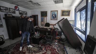 Palestinians inspect a damaged Pepsi factory near a street that Israel reportedly attacked after Palestinian militants fired rockets at Israel, in Gaza City. EPA