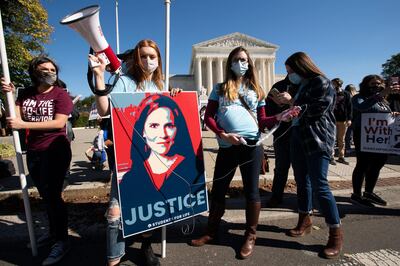 Supporters of Amy Coney Barrett rally outside the Supreme Court building during the Women's March in Washington on Saturday. AP Photo