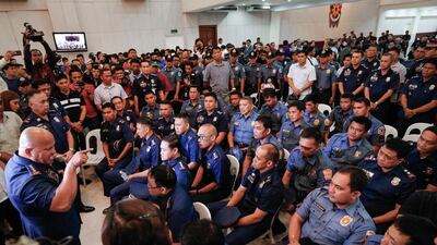 The Philippines national police chief Ronald dela Rosa speaks to police officers allegedly involved in the illegal drug trade at Camp Crame in Quezon City, north-east of Manila, on August 8, 2016. Mark R Cristino / EPA
