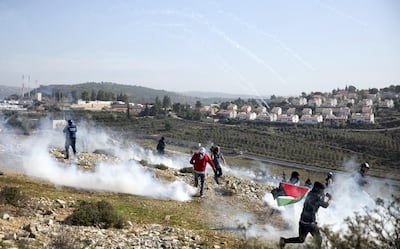 Palestinian protesters clash with Israeli forces during a demonstration in Nabi Saleh on January 13, 2018. Heidi Levine
