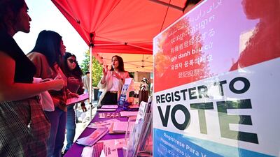 A voter registration desk at Voter Fest 2024 at Cal State, Los Angeles. AFP