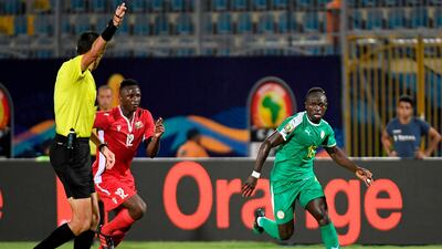 Kenya midfielder Victor Wanyama, left, fights for the ball with Senegal forward Sadio Mane during the 2019 Africa Cup of Nations Group C match at the 30 June Stadium in Cairo. Senegal won the match 3-0. AFP