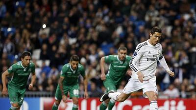 Real Madrid's Cristiano Ronaldo scores a penalty kick during the Uefa Champions League Group B match against Ludogorets at the Santiago Bernabeu stadium in Madrid on December 9, 2014. Susana Vera / Reuters