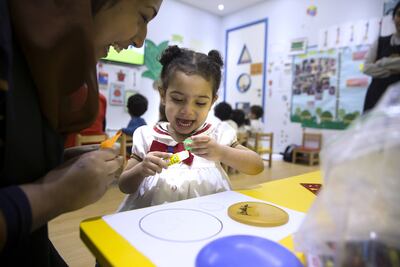 Working mothers navigate the challenges of soaring childcare costs, emphasizing the need for innovative solutions and support to help them re-join the workforce. Silvia Razgova / The National