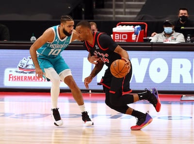 Toronto Raptors guard Norman Powell drives to the basket against Charlotte Hornets forward Caleb Martin. Reuters