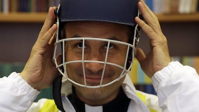 Monsignor Sanchez de Toca y Alameda, undersecretary of the Pontifical Council for Culture, puts on a cricket helmet. Gregorio Borgia / AP Photo