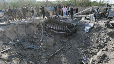 Lebanese soldiers and local residents stand at the site of an Israeli airstrike in the southern Lebanese village of Toura on November 6, 2025. Hezbollah lashed out on November 6 against the prospect of any political negotiations between Lebanon and Israel, and insisted that it has a right to defend itself. (Photo by MAHMOUD ZAYYAT / AFP)