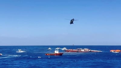 A helicopter rescues a passenger off a ferry that capsized off the coast of northern Cyprus. Reuters / Reuters TV