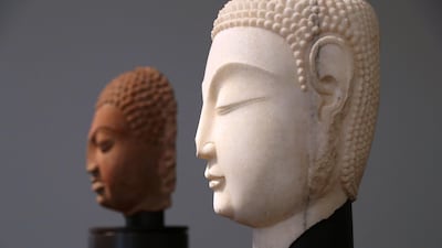 A head of the Buddha from Northern China's Qi dynasty (c.550 CE). Chris Whiteoak / The National