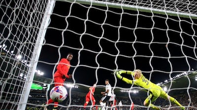 Ragnar Klavan of Liverpool scores the opening goal past Jonathan Mitchell of Derby County. Richard Heathcote / Getty Images