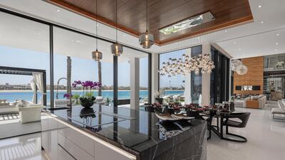 The formal kitchen and dining area. Courtesy Luxhabitat Sotheby's International Realty