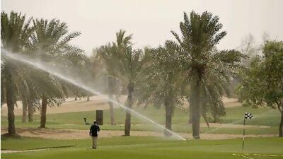 ABU DHABI, UNITED ARAB EMIRATES - June 10, 2009: Sprinklers and water help keep the grass green at Abu Dhabi Golf Club. ( Ryan Carter / The National ) *** stock, water, golf, green, sprinklers *** Local Caption *** RC029-UAEgolf.JPG RC029-UAEgolf_2.JPGRC029-UAEgolf_2.JPG