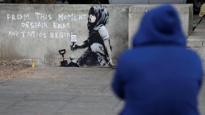 A graffiti believed to have been created by street artist Banksy is seen at Marble Arch. Reuters