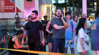 People gather at the scene of the shooting. AFP