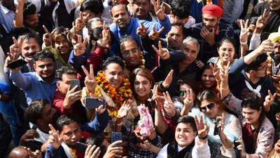 Ajay Gupta, from the Aam Aadmi Party, celebrates with supporters in Amritsar. AP Photo