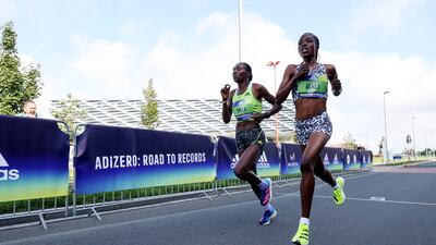 Agnes Tirop (R) of Kenya wins the ADIZERO: ROAD TO RECORDS Women's 10km in 30:01 at adidas HQ. Getty Images