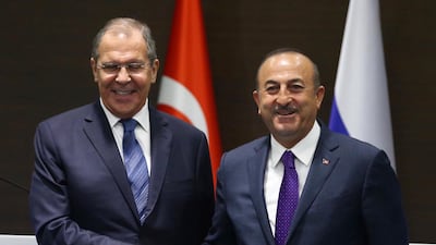 Turkey's Foreign Minister Mevlut Cavusoglu, right, and his Russian counterpart Sergei Lavrov shake hands after a news conference in the Mediterranean coastal city of Antalya, Turkey, Friday, March 29, 2019. AP