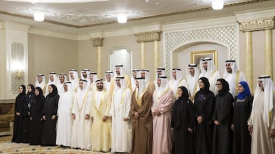 Sheikh Mohammed bin Rashid, Prime Minister and Ruler of Dubai, and Sheikh Mohammed bin Zayed, Crown Prince of Abu Dhabi and Deputy Supreme Commander of the Armed Forces, stand for a photograph with ministers during their swearing-in ceremony at Mushrif Palace on Sunday. Ryan Carter / Crown Prince Court – Abu Dhabi