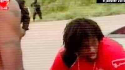 The Togolese footballer Emmanuel Adebayor is seen on Angolan television being comforted by a teammate after gunmen opened fire on the team's bus on Friday.