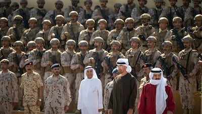 Sheikh Mohamed and King Hamad with military personnel taking part in Rabdan-Shuwaiman