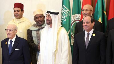 Tunisian President Beji Caid Essebsi, Abu Dhabi's Crown Prince Sheikh Mohammed bin Zayed and Egyptian President Abdel Fattah al-Sisi stand during a group photo with Arab leaders, ahead of the Arab Summit in Mecca, Saudi Arabia. Reuters