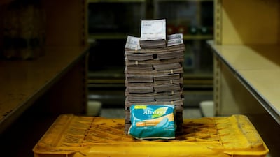 A package of pads is pictured next to 3,500,000 bolivars