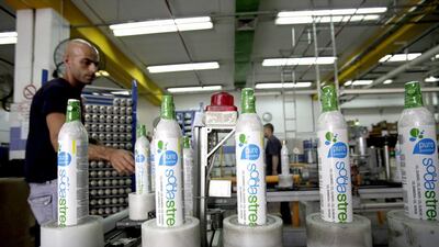 An employee packages carbon dioxide (CO2) cylinders at the SodaStream factory in Mishor Adumim, near Jerusalem, Israel. Ariel Jerozolimski / Bloomberg