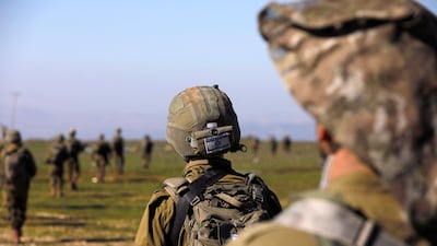 Israeli soldiers walk near Moshav Sha'al in the Israeli-annexed Golan Heights on February 9. AFP