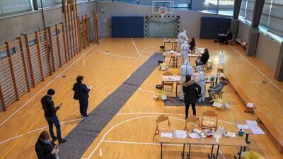 Resident line in the school sports hall. AFP