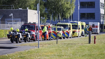 Medics await the arrival of a medical plane at the Schiphol airport. AFP