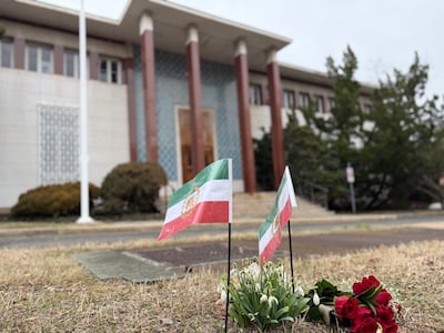 Pre-Islamic Revolution flags outside Iran's abandoned embassy in Washington. The National