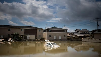 A car sits in water after the area was devastated by flooding and landslides in Mabi, Okayama. AFP