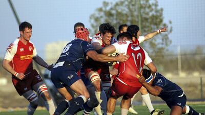 Jebel Ali Dragons, blue, produced an important win over Bahrain pn Friday to boost their West Asia Premiership hopes. Satish Kumar for The National