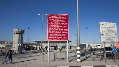 An Israeli sign, written in Hebrew, Arabic and English, at the entrance of the Qalandiya checkpoint between Jerusalem and Ramallah. Ahmad Gharabli / AFP / February 9, 2014