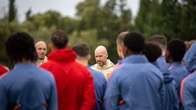 Manager Erik ten Hag talks to his players.