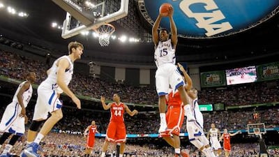 Elijah Johnson, No 15, of the Kansas Jayhawks grabs a rebound in the second half against the Ohio State Buckeyes during the National semi-final game