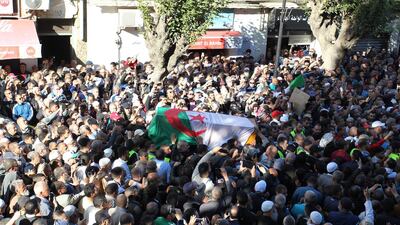 Mourners carry the coffin of Abassi Madani, founder of Algeria's banned Islamic Salvation Front (FIS), in the central Belcourt neighbourhood of the capital Algiers on April 27, 2019. Madani died in Qatar where he lived in exile. AFP