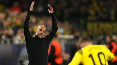 City manager Pep Guardiola gestures on the touchline. EPA