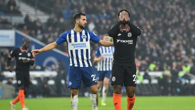 Chelsea's midfielder Callum Hudson-Odoi, right, reacts after missing a chance at the American Express Community Stadium. AFP